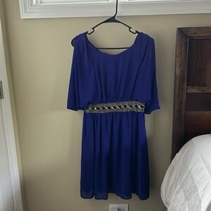 Purple lace back dressby YA Los Angeles